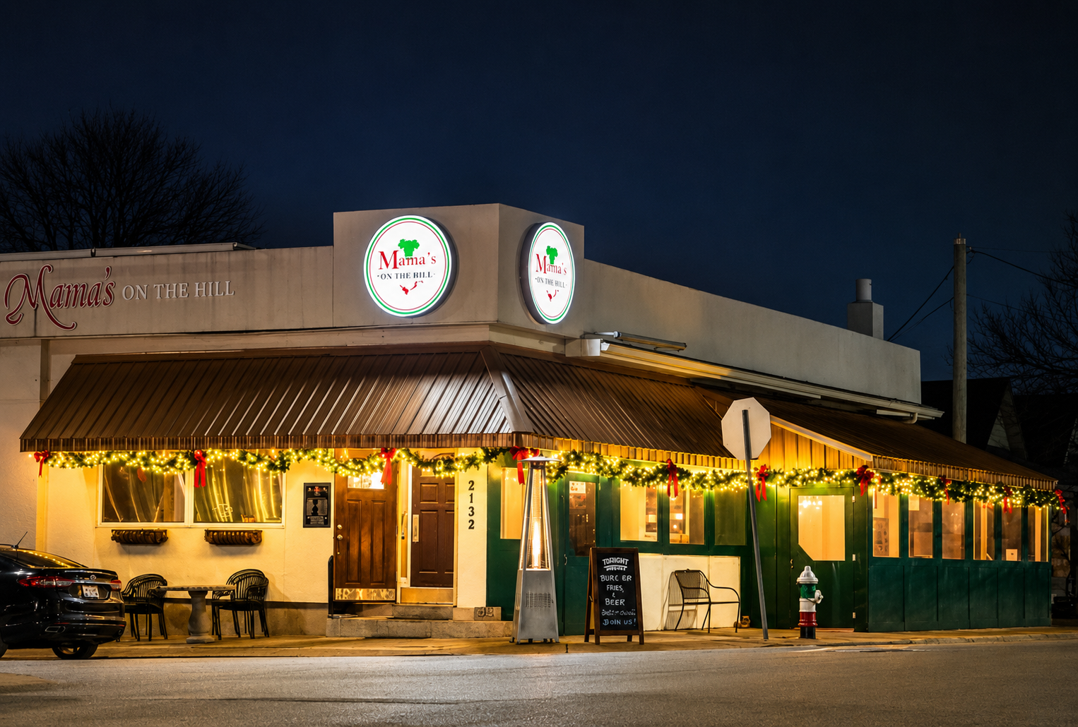 Mama's on The Hill restaurant in St. Louis with lit garland and red bows